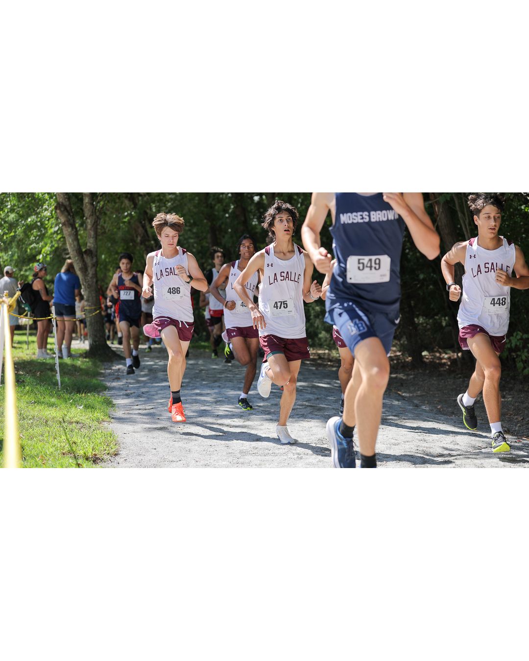 #549 Mateo Caranci, Moses Brown School, 5k Run - Boys (Myers), P55, 20:56.22; #448 Zackary Bacon, La Salle Academy, 5k Run - Boys (Myers), P79, 22:16.73; #475 Russell Sanchez De Lasorda, La Salle Academy, 5k Run - Boys (Myers), P67, 21:30.67 - #549 Mateo Caranci, Moses Brown School, 5k Run - Boys (Myers), P55, 20:56.22; #475 Russell Sanchez De Lasorda, La Salle Academy, 5k Run - Boys (Myers), P67, 21:30.67; #486 Hawkins Truskoski-McKenna, La Salle Academy, 5k Run - Boys (Myers), P41, 20:06.25 - 2026 Injury Fund Carnival XC - Deerfield Park - Greenville, Rhode Island - September 05, 2026 File: ./dir-7-5k_Run-Boys-Myers/260905-2026-injury-fund-xc-deerfield-park-1086-398A7547.jpg #549 Mateo Caranci, Moses Brown School, 5k Run - Boys (Myers), P55, 20:56.22; #448 Zackary Bacon, La Salle Academy, 5k Run - Boys (Myers),…