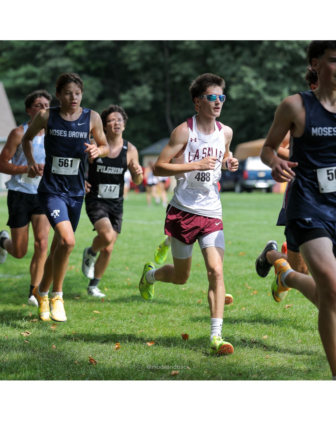 #488 Eric Wilding, La Salle Academy, 5k Run - Boys (Myers), P27, 19:05.73; #561 Braden Phyfe, Moses Brown School, 5k Run - Boys (Myers), P15, 18:21.38; #747 Miles Zuniga, Pilgrim High School, 5k Run - Boys (Myers), P23, 18:53.13 - #488 Eric Wilding, La Salle Academy, 5k Run - Boys (Myers), P27, 19:05.73; #561 Braden Phyfe, Moses Brown School, 5k Run - Boys (Myers), P15, 18:21.38 - 2026 Injury Fund Carnival XC - Deerfield Park - Greenville, Rhode Island - September 05, 2026 File: ./dir-7-5k_Run-Boys-Myers/260905-2026-injury-fund-xc-deerfield-park-1126-398A7976.jpg #488 Eric Wilding, La Salle Academy, 5k Run - Boys (Myers), P27, 19:05.73; #561 Braden Phyfe, Moses Brown School, 5k Run - Boys (Myers), P1…