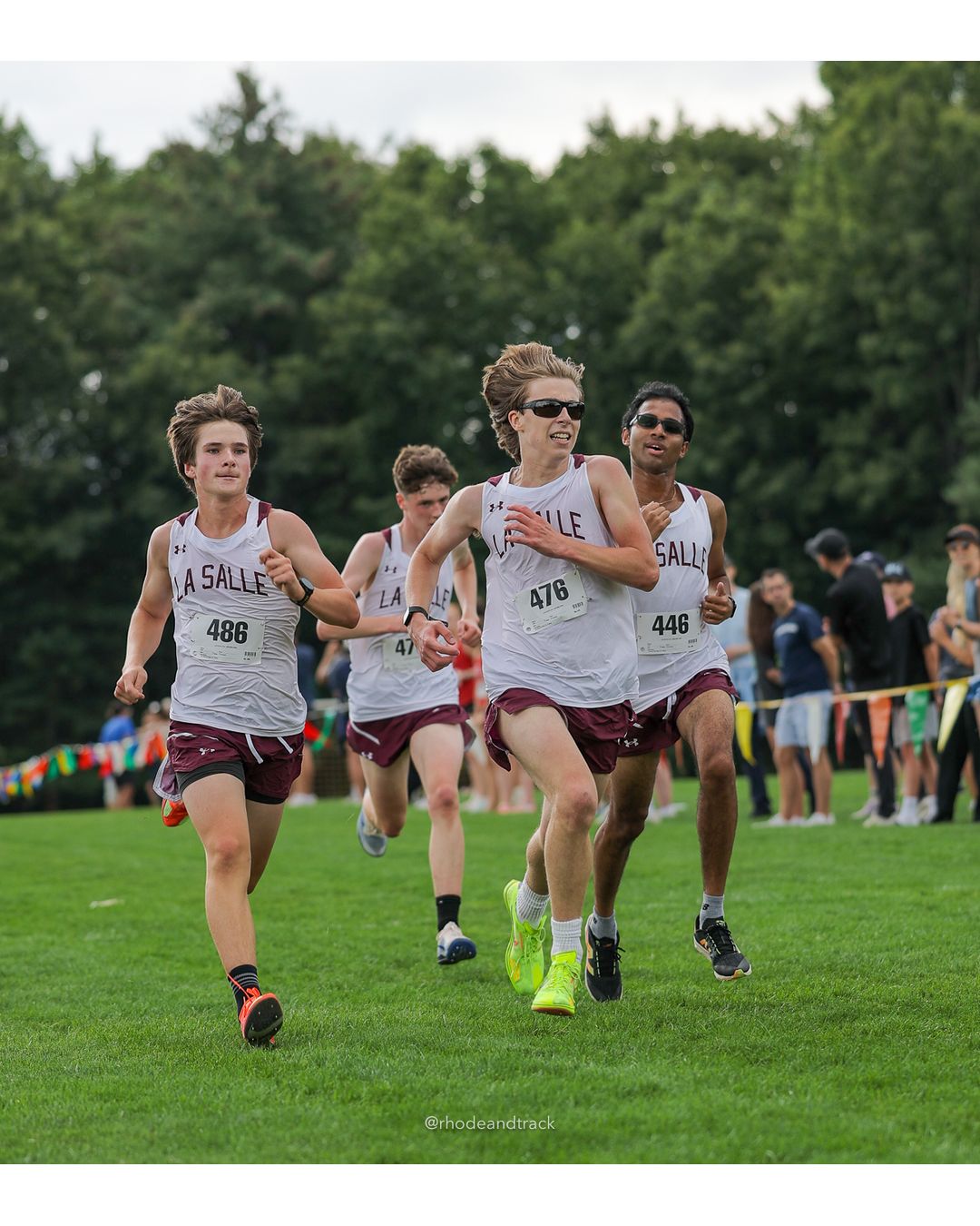 #476 Nick Scotti, La Salle Academy, 5k Run - Boys (Myers), P42, 20:06.71; #486 Hawkins Truskoski-McKenna, La Salle Academy, 5k Run - Boys (Myers), P41, 20:06.25; #446 Ashwat Anand, La Salle Academy, 5k Run - Boys (Myers), P44, 20:07.38 - #476 Nick Scotti, La Salle Academy, 5k Run - Boys (Myers), P42, 20:06.71; #486 Hawkins Truskoski-McKenna, La Salle Academy, 5k Run - Boys (Myers), P41, 20:06.25; #446 Ashwat Anand, La Salle Academy, 5k Run - Boys (Myers), P44, 20:07.38 - 2026 Injury Fund Carnival XC - Deerfield Park - Greenville, Rhode Island - September 05, 2026 File: ./dir-7-5k_Run-Boys-Myers/260905-2026-injury-fund-xc-deerfield-park-1213-398A9789.jpg #476 Nick Scotti, La Salle Academy, 5k Run - Boys (Myers), P42, 20:06.71; #486 Hawkins Truskoski-McKenna, La Salle Academy, 5k Run - Boys (…