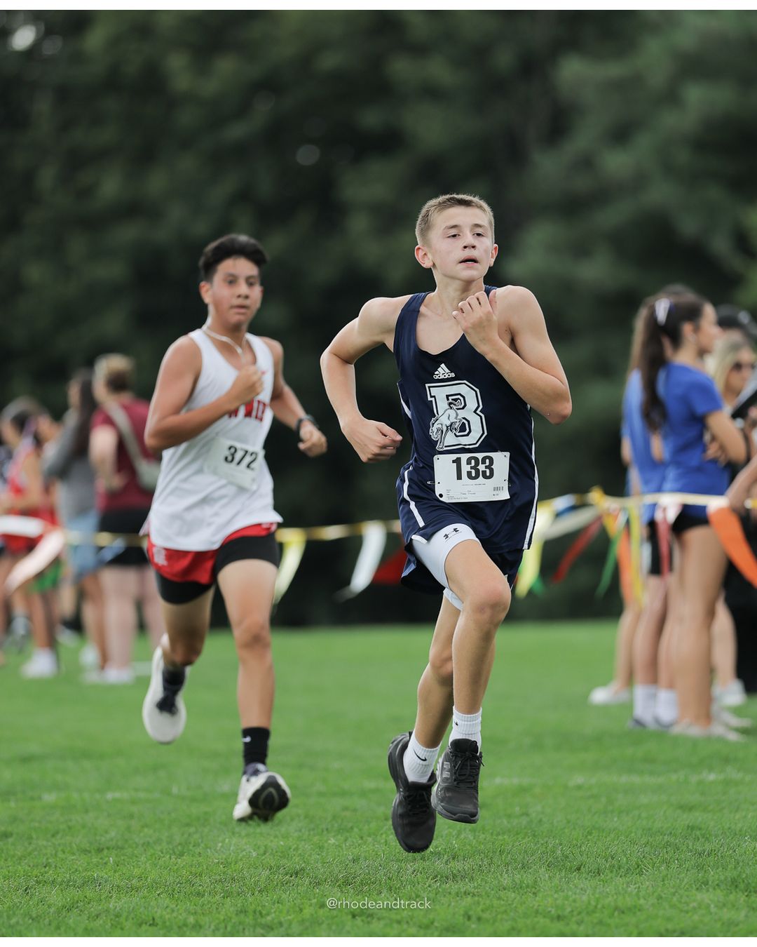 #372 Christian Mendez-Molina, East Providence High School, 5k Run - Boys (Myers), P66, 21:27.60; #133 Camden Muldoon, Burrillville High School, 5k Run - Boys (Myers), P65, 21:26.10 - 2026 Injury Fund Carnival XC - Deerfield Park - Greenville, Rhode Island - September 05, 2026 File: ./dir-7-5k_Run-Boys-Myers/260905-2026-injury-fund-xc-deerfield-park-1233-398A0155.jpg #372 Christian Mendez-Molina, East Providence High School, 5k Run - Boys (Myers), P66, 21:27.60; #133 Camden Muldoon, Burrillville High Sch…
