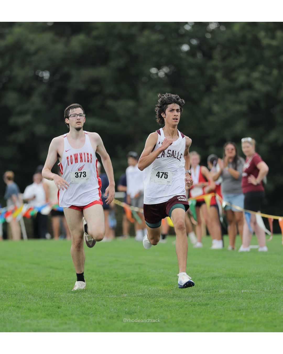 #475 Russell Sanchez De Lasorda, La Salle Academy, 5k Run - Boys (Myers), P67, 21:30.67; #373 Anthony Mendonca, East Providence High School, 5k Run - Boys (Myers), P68, 21:32.10 - #475 Russell Sanchez De Lasorda, La Salle Academy, 5k Run - Boys (Myers), P67, 21:30.67 - 2026 Injury Fund Carnival XC - Deerfield Park - Greenville, Rhode Island - September 05, 2026 File: ./dir-7-5k_Run-Boys-Myers/260905-2026-injury-fund-xc-deerfield-park-1235-398A0183.jpg #475 Russell Sanchez De Lasorda, La Salle Academy, 5k Run - Boys (Myers), P67, 21:30.67; #373 Anthony Mendonca, East Providence High School…