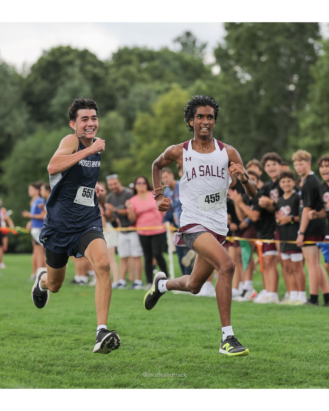 #455 Gilchrist Daniel, La Salle Academy, 5k Run - Boys (Myers), P69, 21:44.64; #558 Leiton Kraut, Moses Brown School, 5k Run - Boys (Myers), P70, 21:45.01 - #455 Gilchrist Daniel, La Salle Academy, 5k Run - Boys (Myers), P69, 21:44.64 - 2026 Injury Fund Carnival XC - Deerfield Park - Greenville, Rhode Island - September 05, 2026 File: ./dir-7-5k_Run-Boys-Myers/260905-2026-injury-fund-xc-deerfield-park-1238-398A0235.jpg #455 Gilchrist Daniel, La Salle Academy, 5k Run - Boys (Myers), P69, 21:44.64; #558 Leiton Kraut, Moses Brown School, 5k Run - Boys (Myers)…