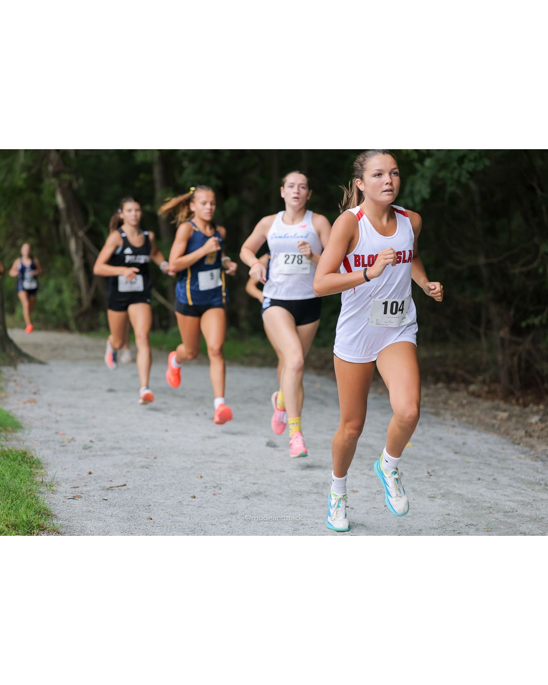 #104 Keira Closter, Block Island High School, 5k Run - Girls (Caswell), P3, 19:15.65; #278 Anna Bianchi, Cumberland, 5k Run - Girls (Caswell), P6, 20:36.60 - #104 Keira Closter, Block Island High School, 5k Run - Girls (Caswell), P3, 19:15.65; #278 Anna Bianchi, Cumberland, 5k Run - Girls (Caswell), P6, 20:36.60 - 2026 Injury Fund Carnival XC - Deerfield Park - Greenville, Rhode Island - September 05, 2026 File: ./dir-8-5k_Run-Girls-Caswell/260905-2026-injury-fund-xc-deerfield-park-1280-398A0900.jpg #104 Keira Closter, Block Island High School, 5k Run - Girls (Caswell), P3, 19:15.65; #278 Anna Bianchi, Cumberland, 5k Run - Girls (Caswel…