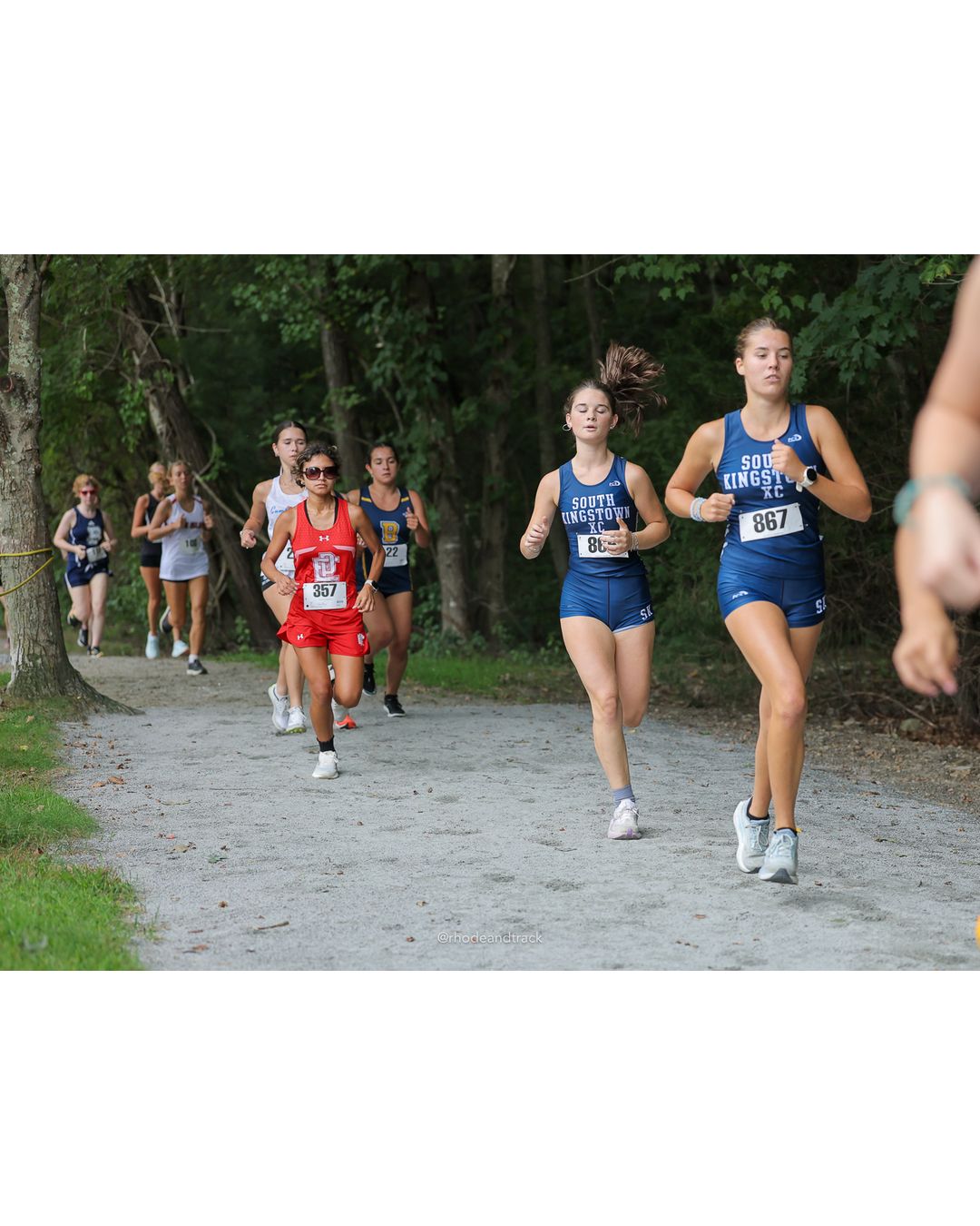 #867 Mary Guidera, South Kingstown High School, 5k Run - Girls (Caswell), P24, 23:42.57; #357 Melany Sotomayor, East Providence High School, 5k Run - Girls (Caswell), P20, 23:12.63 - #867 Mary Guidera, South Kingstown High School, 5k Run - Girls (Caswell), P24, 23:42.57 - 2026 Injury Fund Carnival XC - Deerfield Park - Greenville, Rhode Island - September 05, 2026 File: ./dir-8-5k_Run-Girls-Caswell/260905-2026-injury-fund-xc-deerfield-park-1288-398A0995.jpg #867 Mary Guidera, South Kingstown High School, 5k Run - Girls (Caswell), P24, 23:42.57; #357 Melany Sotomayor, East Providence High School…
