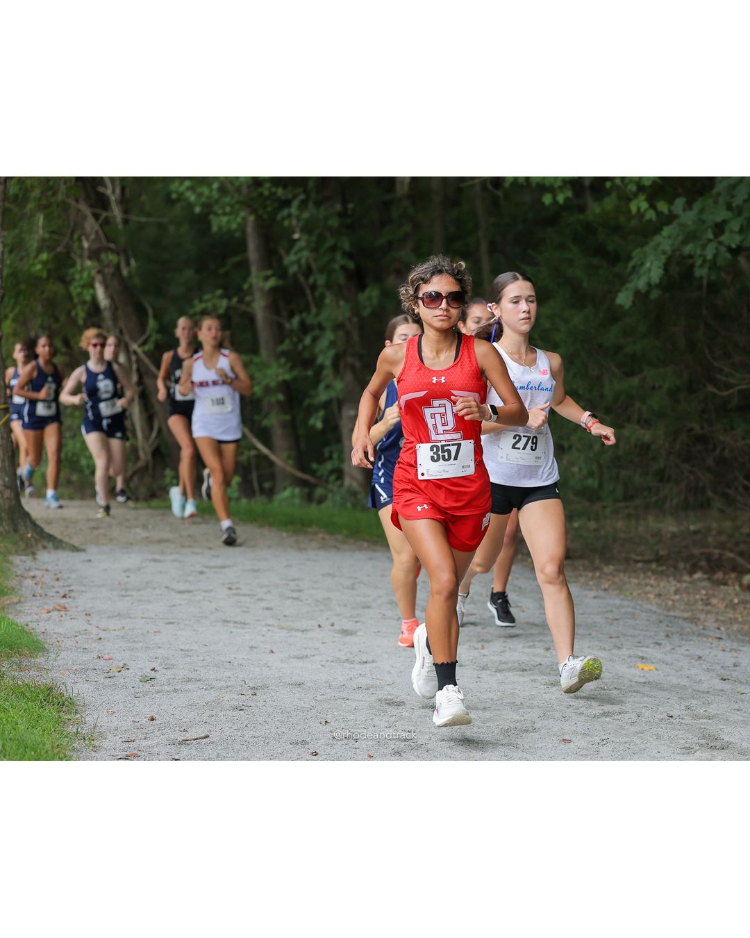 #357 Melany Sotomayor, East Providence High School, 5k Run - Girls (Caswell), P20, 23:12.63; #279 Rebecca Davis, Cumberland, 5k Run - Girls (Caswell), P15, 22:51.39 - #357 Melany Sotomayor, East Providence High School, 5k Run - Girls (Caswell), P20, 23:12.63; #279 Rebecca Davis, Cumberland, 5k Run - Girls (Caswell), P15, 22:51.39 - 2026 Injury Fund Carnival XC - Deerfield Park - Greenville, Rhode Island - September 05, 2026 File: ./dir-8-5k_Run-Girls-Caswell/260905-2026-injury-fund-xc-deerfield-park-1289-398A1005.jpg #357 Melany Sotomayor, East Providence High School, 5k Run - Girls (Caswell), P20, 23:12.63; #279 Rebecca Davis, Cumberland, 5k Run - Girls…