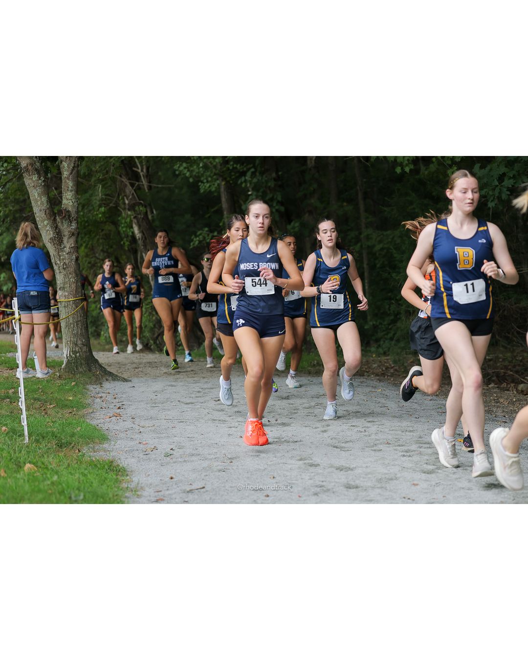 #19 Rose Rakeman, Barrington High School, 5k Run - Girls (Caswell), P30, 25:10.05; #544 Grace Wilson, Moses Brown School, 5k Run - Girls (Caswell), P22, 23:26.28; #11 Sophie Halloran, Barrington High School, 5k Run - Girls (Caswell), P32, 25:29.91 - 2026 Injury Fund Carnival XC - Deerfield Park - Greenville, Rhode Island - September 05, 2026 File: ./dir-8-5k_Run-Girls-Caswell/260905-2026-injury-fund-xc-deerfield-park-1294-398A1068.jpg #19 Rose Rakeman, Barrington High School, 5k Run - Girls (Caswell), P30, 25:10.05; #544 Grace Wilson, Moses Brown School, 5k Run - Girls (C…