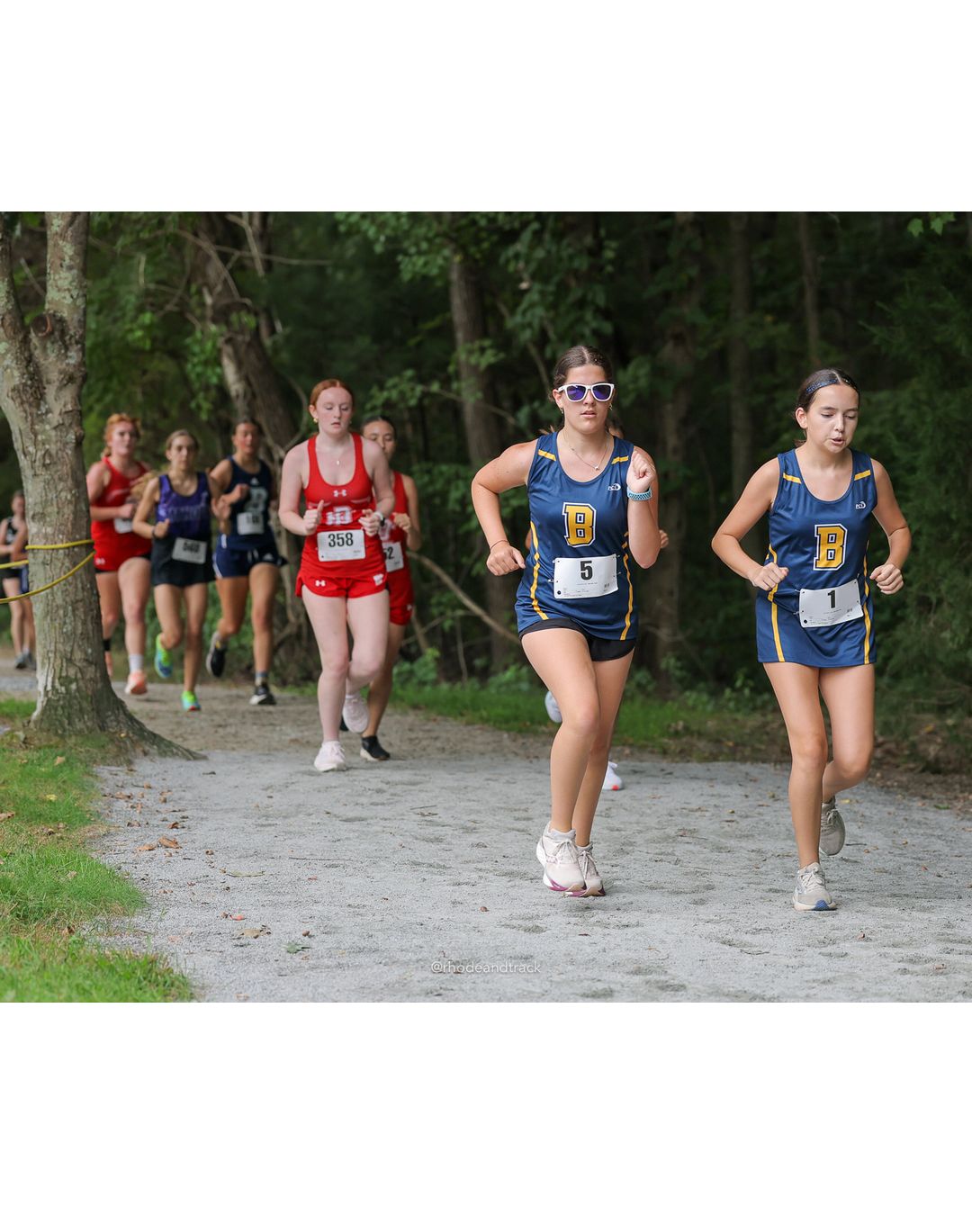 #19 Rose Rakeman, Barrington High School, 5k Run - Girls (Caswell), P30, 25:10.05; #358 Margaret Thomson, East Providence High School, 5k Run - Girls (Caswell), P45, 28:12.73 - #19 Rose Rakeman, Barrington High School, 5k Run - Girls (Caswell), P30, 25:10.05; #5 Mila Djuranovic, Barrington High School, 5k Run - Girls (Caswell), P57, 31:06.51 - 2026 Injury Fund Carnival XC - Deerfield Park - Greenville, Rhode Island - September 05, 2026 File: ./dir-8-5k_Run-Girls-Caswell/260905-2026-injury-fund-xc-deerfield-park-1299-398A1153.jpg #19 Rose Rakeman, Barrington High School, 5k Run - Girls (Caswell), P30, 25:10.05; #358 Margaret Thomson, East Providence High School, 5k R…
