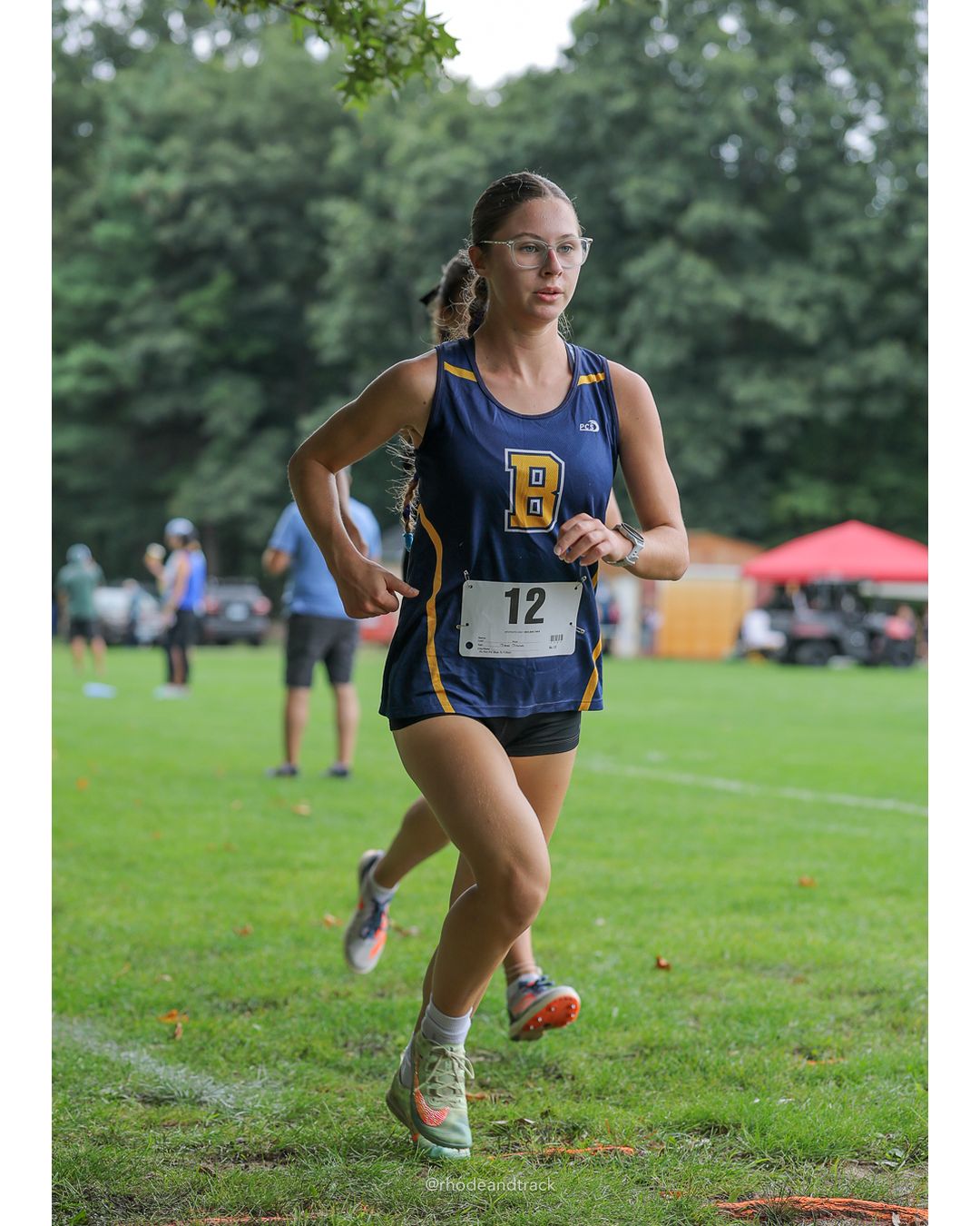 #19 Rose Rakeman, Barrington High School, 5k Run - Girls (Caswell), P30, 25:10.05; #12 Evelyn Lefort, Barrington High School, 5k Run - Girls (Caswell), P2, 19:04.85 - 2026 Injury Fund Carnival XC - Deerfield Park - Greenville, Rhode Island - September 05, 2026 File: ./dir-8-5k_Run-Girls-Caswell/260905-2026-injury-fund-xc-deerfield-park-1334-398A1297.jpg #19 Rose Rakeman, Barrington High School, 5k Run - Girls (Caswell), P30, 25:10.05; #12 Evelyn Lefort, Barrington High School, 5k Run - Girl…