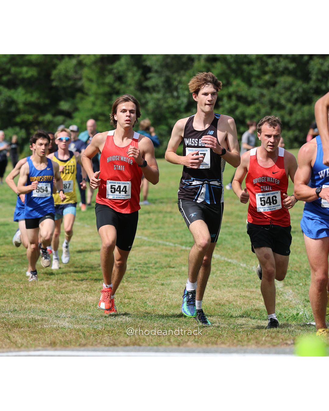 #546 Nicholas Rodden, Bridgewater St., 8k Run - Men (Gold-35:cap), P210, 30:17.01; #544 Noah Johnson, Bridgewater St., 8k Run - Men (Gold-35:cap), P189, 29:07.85; #954 Taku Pettengill, Worcester State, 8k Run - Men (Gold-35:cap), P187, 28:57.56 - 2026 UMass Dartmouth XC Invitational - UMass Dartmouth - Dartmouth, Massachusetts - September 19, 2026 File: ./260919-2026-UMass-Dartmouth-XC-Invitational-118-398A5761.jpg #546 Nicholas Rodden, Bridgewater St., 8k Run - Men (Gold-35:cap), P210, 30:17.01; #544 Noah Johnson, Bridgewater St., 8k Run - Men (Gold-3…