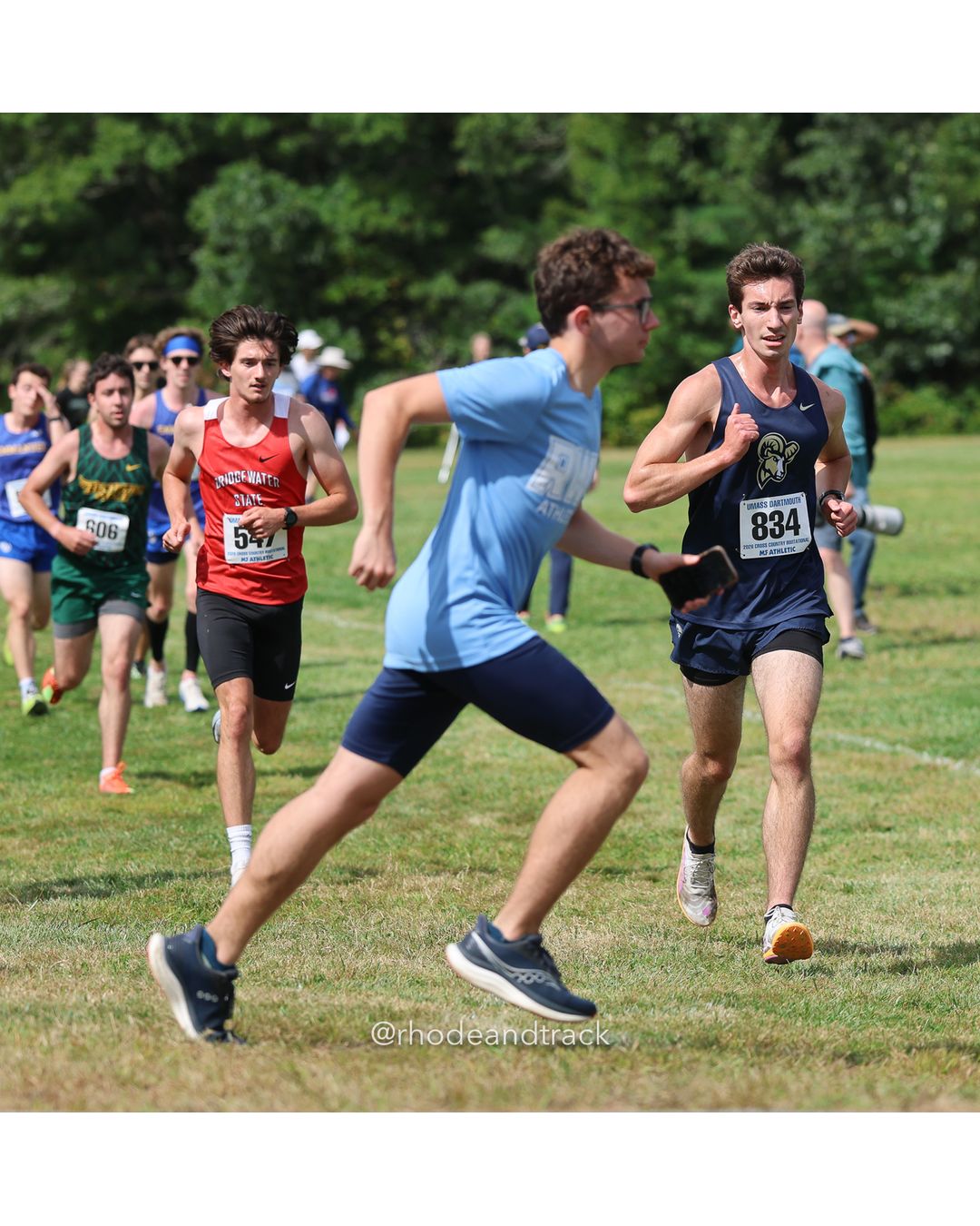 #834 Eric Anderson, Suffolk, 8k Run - Men (Gold-35:cap), P231, 32:22.17; #5 Darcy Derose, American Int'l, 6k Run - Women (Navy-45:cap), P176, 37:12.86 - 2026 UMass Dartmouth XC Invitational - UMass Dartmouth - Dartmouth, Massachusetts - September 19, 2026 File: ./260919-2026-UMass-Dartmouth-XC-Invitational-122-398A5795.jpg #834 Eric Anderson, Suffolk, 8k Run - Men (Gold-35:cap), P231, 32:22.17; #5 Darcy Derose, American Int'l, 6k Run - Women (Navy-45:cap), P17…