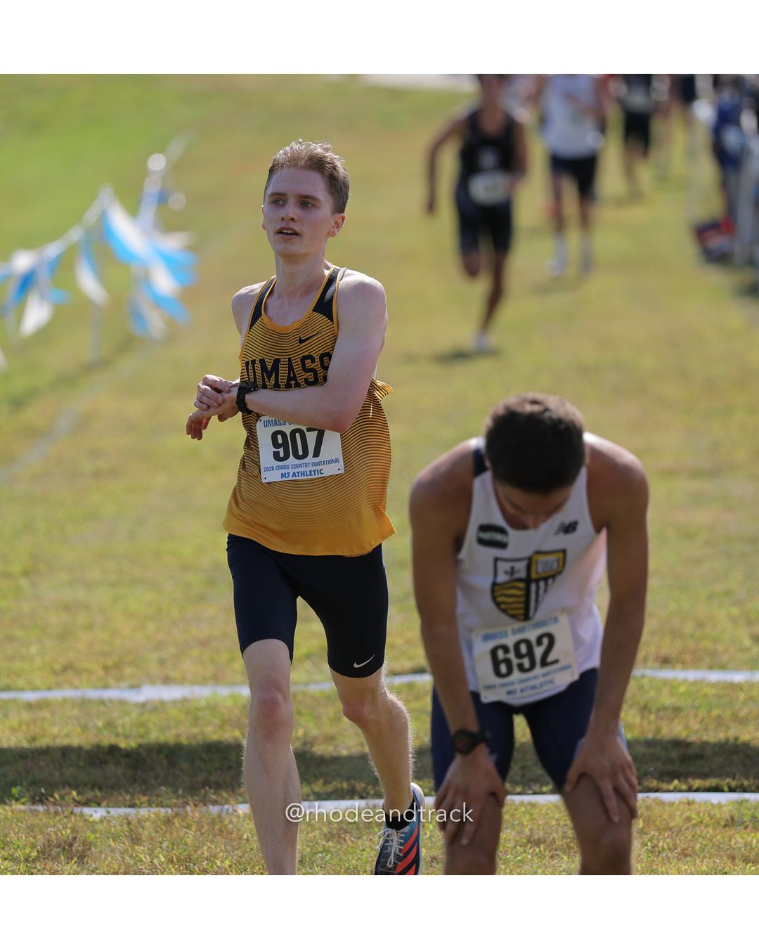 #692 Nicolas FloresQuero Llamas, Merrimack, 8k Run - Men (Navy-45:cap), P27, 26:52.44; #907 Frank Wenner, UMD Alumni, 8k Run - Men (Navy-45:cap), P28, 26:55.79 - 2026 UMass Dartmouth XC Invitational - UMass Dartmouth - Dartmouth, Massachusetts - September 19, 2026 File: ./260919-2026-UMass-Dartmouth-XC-Invitational-16-398A3888.jpg #692 Nicolas FloresQuero Llamas, Merrimack, 8k Run - Men (Navy-45:cap), P27, 26:52.44; #907 Frank Wenner, UMD Alumni, 8k Run - Men (Navy-45…