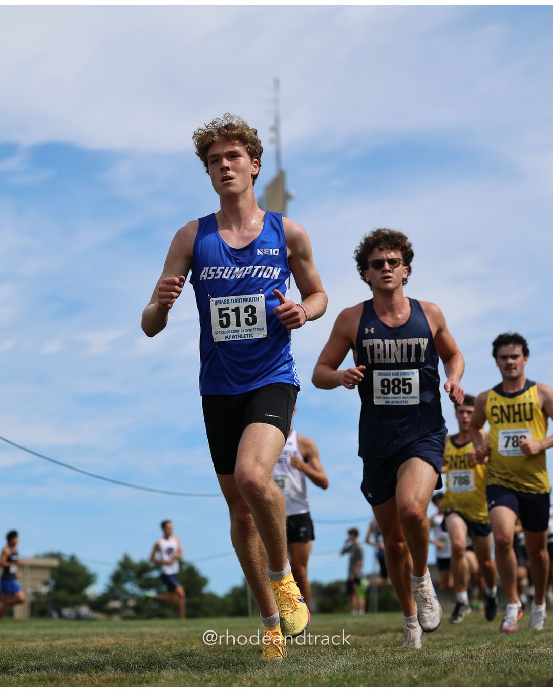 #513 Eli Lipson, Assumption, 8k Run - Men (Gold-35:cap), P149, 27:51.73; #985 Brendan Nolan, Trinity (Conn.), 8k Run - Men (Gold-35:cap), P133, 27:27.04; #78 Violet Lowney, Connecticut College, 6k Run - Women (Navy-45:cap), P40, 24:50.94 - 2026 UMass Dartmouth XC Invitational - UMass Dartmouth - Dartmouth, Massachusetts - September 19, 2026 File: ./260919-2026-UMass-Dartmouth-XC-Invitational-186-398A6943.jpg #513 Eli Lipson, Assumption, 8k Run - Men (Gold-35:cap), P149, 27:51.73; #985 Brendan Nolan, Trinity (Conn.), 8k Run - Men (Gold-35:cap), P…