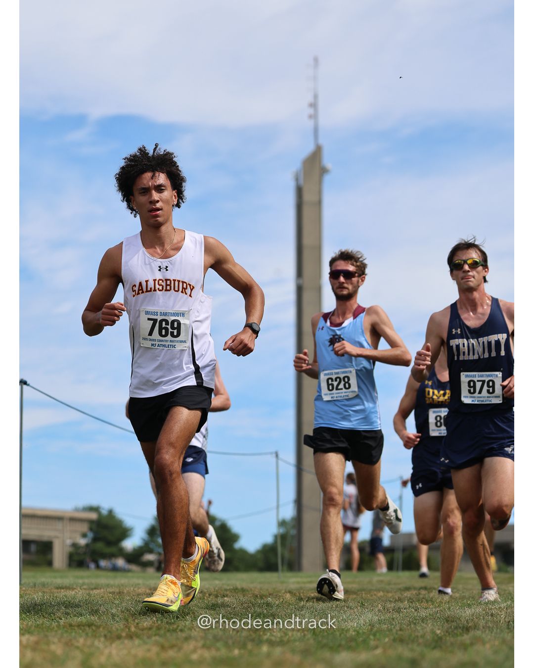 #769 Aidan Foster, Salisbury, 8k Run - Men (Gold-35:cap), P0,; #628 Abner Neumann, Franklin Pierce, 8k Run - Men (Gold-35:cap), P163, 28:10.00; #979 Tim Hamilton, Trinity (Conn.), 8k Run - Men (Gold-35:cap), P186, 28:57.31 - 2026 UMass Dartmouth XC Invitational - UMass Dartmouth - Dartmouth, Massachusetts - September 19, 2026 File: ./260919-2026-UMass-Dartmouth-XC-Invitational-194-398A7050.jpg #769 Aidan Foster, Salisbury, 8k Run - Men (Gold-35:cap), P0,; #628 Abner Neumann, Franklin Pierce, 8k Run - Men (Gold-35:cap), P163, 28:10…