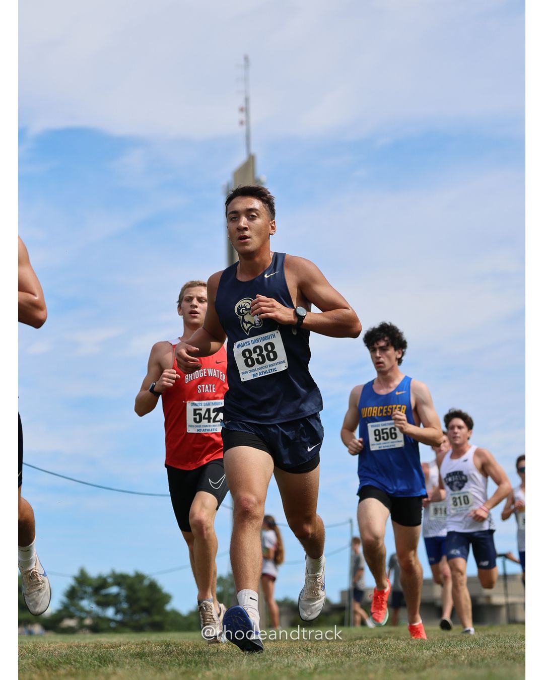 #838 Nikolaus Gibson, Suffolk, 8k Run - Men (Gold-35:cap), P173, 28:27.06; #542 Jacob Anuszczyk, Bridgewater St., 8k Run - Men (Gold-35:cap), P155, 28:02.69; #956 Lincoln Schiller, Worcester State, 8k Run - Men (Gold-35:cap), P169, 28:20.44 - 2026 UMass Dartmouth XC Invitational - UMass Dartmouth - Dartmouth, Massachusetts - September 19, 2026 File: ./260919-2026-UMass-Dartmouth-XC-Invitational-205-398A7211.jpg #838 Nikolaus Gibson, Suffolk, 8k Run - Men (Gold-35:cap), P173, 28:27.06; #542 Jacob Anuszczyk, Bridgewater St., 8k Run - Men (Gold-35:cap…