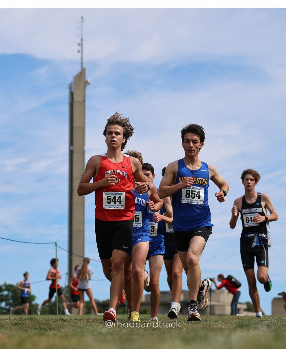 #954 Taku Pettengill, Worcester State, 8k Run - Men (Gold-35:cap), P187, 28:57.56; #544 Noah Johnson, Bridgewater St., 8k Run - Men (Gold-35:cap), P189, 29:07.85; #84 Lilly Pope, Connecticut College, 6k Run - Women (Navy-45:cap), P34, 24:44.29 - 2026 UMass Dartmouth XC Invitational - UMass Dartmouth - Dartmouth, Massachusetts - September 19, 2026 File: ./260919-2026-UMass-Dartmouth-XC-Invitational-218-398A7383.jpg #954 Taku Pettengill, Worcester State, 8k Run - Men (Gold-35:cap), P187, 28:57.56; #544 Noah Johnson, Bridgewater St., 8k Run - Men (Gold-3…