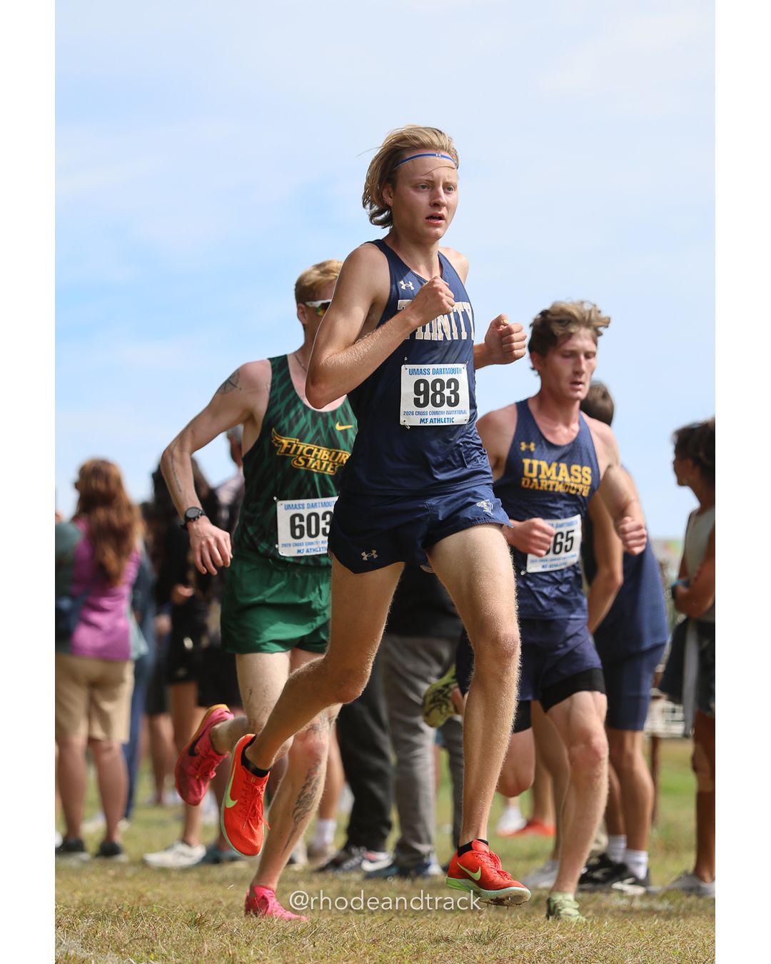 #983 Nielsen Kasser, Trinity (Conn.), 8k Run - Men (Gold-35:cap), P81, 26:26.49; #603 Samuel Edwards, Fitchburg St., 8k Run - Men (Gold-35:cap), P94, 26:39.07; #65 Gracie Canon, Connecticut College - 2026 UMass Dartmouth XC Invitational - UMass Dartmouth - Dartmouth, Massachusetts - September 19, 2026 File: ./260919-2026-UMass-Dartmouth-XC-Invitational-286-398A8951.jpg #983 Nielsen Kasser, Trinity (Conn.), 8k Run - Men (Gold-35:cap), P81, 26:26.49; #603 Samuel Edwards, Fitchburg St., 8k Run - Men (Gold-35:…
