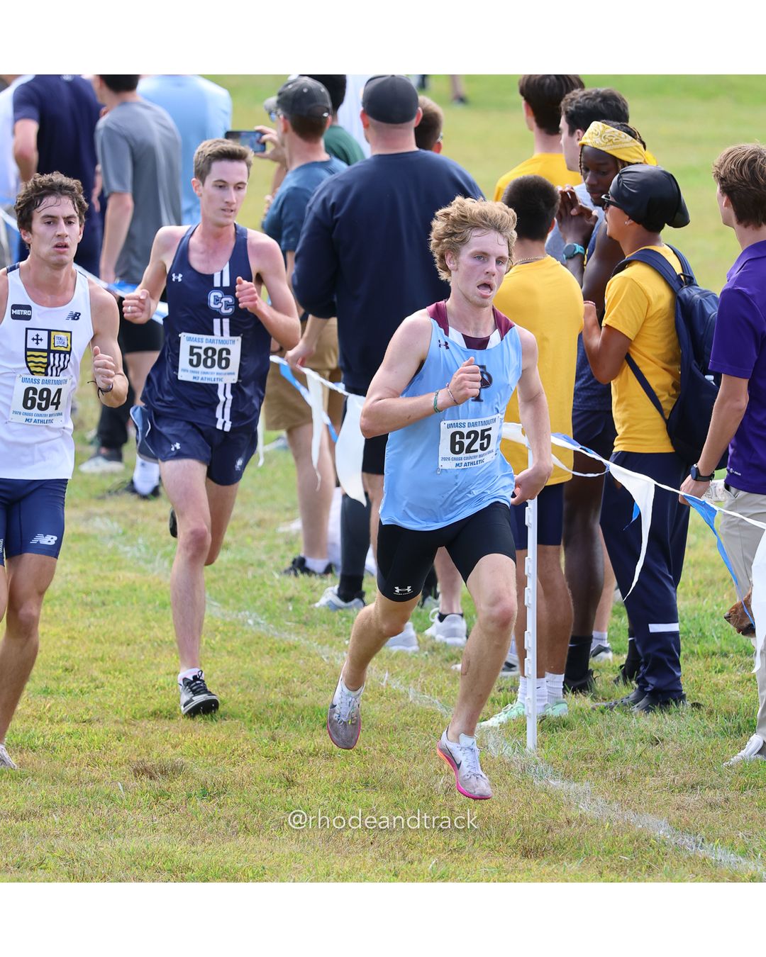 #625 Sam Fortin, Franklin Pierce, 8k Run - Men (Gold-35:cap), P42, 25:49.10; #586 Ronan Staab, Connecticut College, 8k Run - Men (Gold-35:cap), P44, 25:50.33; #694 Sean Moore, Merrimack, 8k Run - Men (Gold-35:cap), P43, 25:49.77 - 2026 UMass Dartmouth XC Invitational - UMass Dartmouth - Dartmouth, Massachusetts - September 19, 2026 File: ./260919-2026-UMass-Dartmouth-XC-Invitational-375-398A0649.jpg #625 Sam Fortin, Franklin Pierce, 8k Run - Men (Gold-35:cap), P42, 25:49.10; #586 Ronan Staab, Connecticut College, 8k Run - Men (Gold-35:c…