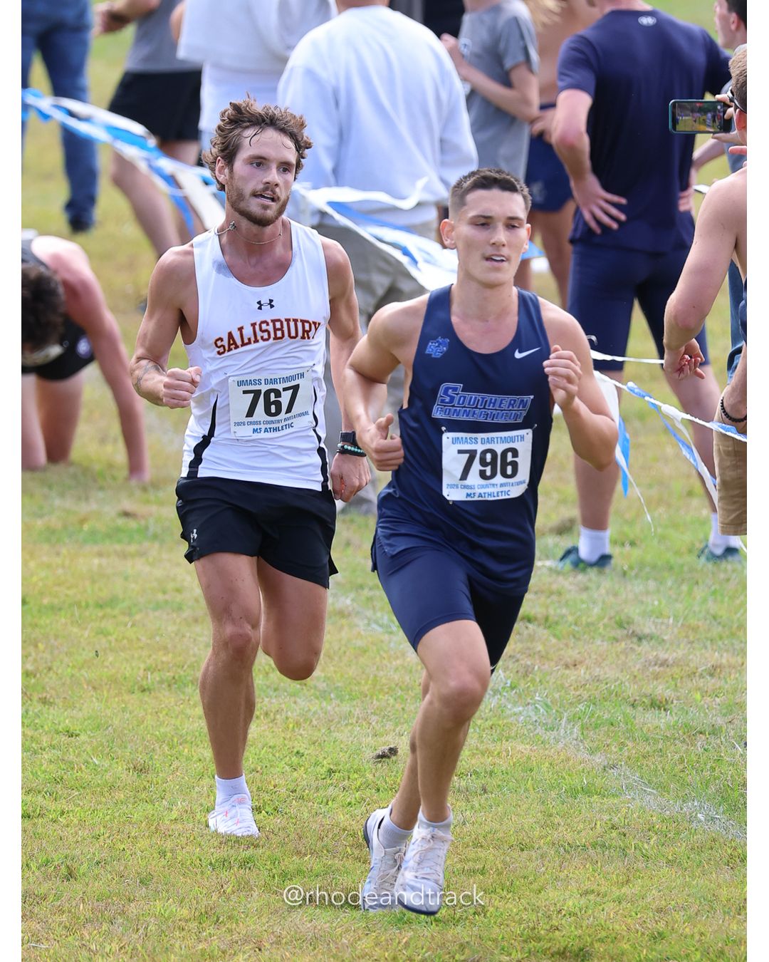 #796 Ryan Gagne, So. Conn. St., 8k Run - Men (Gold-35:cap), P71, 26:19.60; #767 Peyton Dill, Salisbury, 8k Run - Men (Gold-35:cap), P70, 26:18.93 - 2026 UMass Dartmouth XC Invitational - UMass Dartmouth - Dartmouth, Massachusetts - September 19, 2026 File: ./260919-2026-UMass-Dartmouth-XC-Invitational-398-398A1043.jpg #796 Ryan Gagne, So. Conn. St., 8k Run - Men (Gold-35:cap), P71, 26:19.60; #767 Peyton Dill, Salisbury, 8k Run - Men (Gold-35:cap), P70, 26…