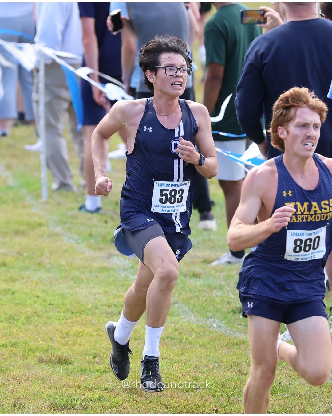 #860 Colin Ozturk, UMass Dartmouth, 8k Run - Men (Gold-35:cap), P106, 26:53.35; #583 Alex Santos-Acosta, Connecticut College, 8k Run - Men (Gold-35:cap), P103, 26:52.26 - 2026 UMass Dartmouth XC Invitational - UMass Dartmouth - Dartmouth, Massachusetts - September 19, 2026 File: ./260919-2026-UMass-Dartmouth-XC-Invitational-430-398A1564.jpg #860 Colin Ozturk, UMass Dartmouth, 8k Run - Men (Gold-35:cap), P106, 26:53.35; #583 Alex Santos-Acosta, Connecticut College, 8k Run - Men…