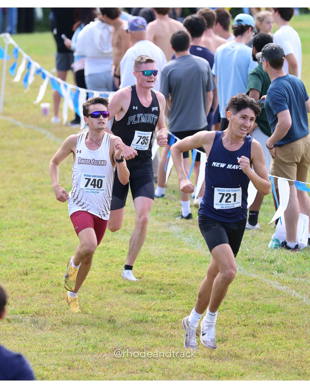 #721 Julian Lika, New Haven, 8k Run - Men (Gold-35:cap), P129, 27:22.07; #740 Andrew Frezza, RIC, 8k Run - Men (Gold-35:cap), P130, 27:22.23; #735 Cooper O'Neil, Plymouth State, 8k Run - Men (Gold-35:cap), P131, 27:23.94 - 2026 UMass Dartmouth XC Invitational - UMass Dartmouth - Dartmouth, Massachusetts - September 19, 2026 File: ./260919-2026-UMass-Dartmouth-XC-Invitational-448-398A1930.jpg #721 Julian Lika, New Haven, 8k Run - Men (Gold-35:cap), P129, 27:22.07; #740 Andrew Frezza, RIC, 8k Run - Men (Gold-35:cap), P130, 27:22.2…