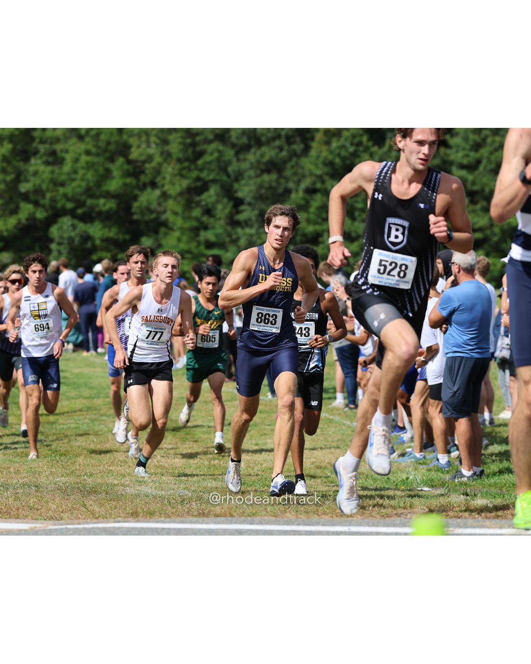 #528 Hayden MacArthur, Bentley, 8k Run - Men (Gold-35:cap), P5, 24:39.32; #863 Declan Smith, UMass Dartmouth, 8k Run - Men (Gold-35:cap), P31, 25:35.33; #43 Janelle Murphy, Bridgewater St., 6k Run - Women (Gold-35:cap), P194, 27:17.83 - 2026 UMass Dartmouth XC Invitational - UMass Dartmouth - Dartmouth, Massachusetts - September 19, 2026 File: ./260919-2026-UMass-Dartmouth-XC-Invitational-46-398A4505.jpg #528 Hayden MacArthur, Bentley, 8k Run - Men (Gold-35:cap), P5, 24:39.32; #863 Declan Smith, UMass Dartmouth, 8k Run - Men (Gold-35:cap), P…