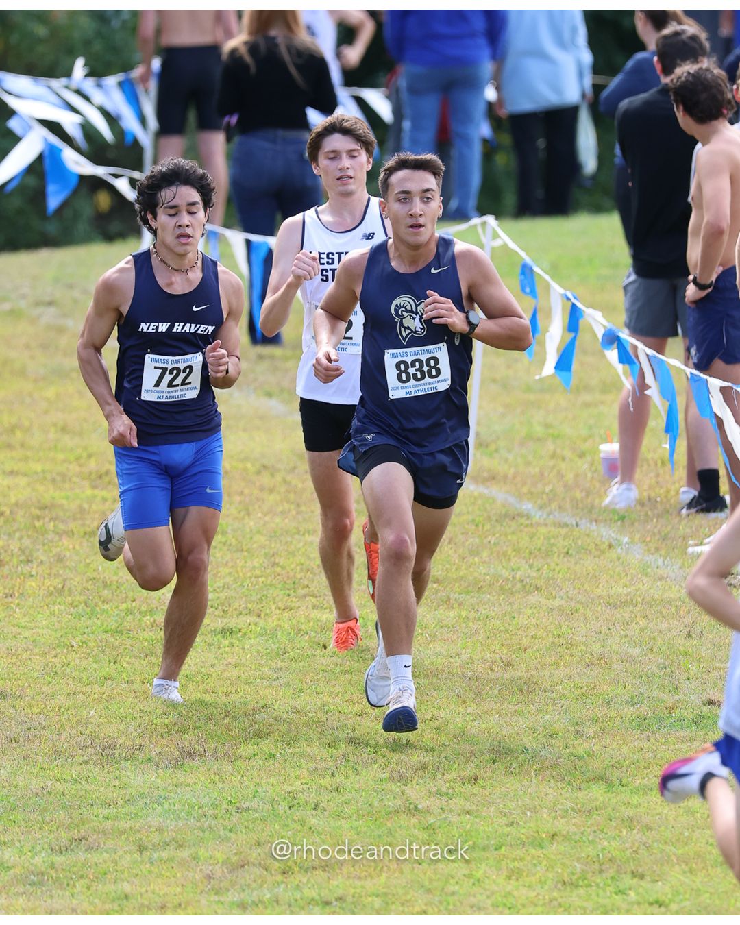 #838 Nikolaus Gibson, Suffolk, 8k Run - Men (Gold-35:cap), P173, 28:27.06; #722 Kittikhom Tighe, New Haven, 8k Run - Men (Gold-35:cap), P170, 28:24.57 - 2026 UMass Dartmouth XC Invitational - UMass Dartmouth - Dartmouth, Massachusetts - September 19, 2026 File: ./260919-2026-UMass-Dartmouth-XC-Invitational-478-398A2689.jpg #838 Nikolaus Gibson, Suffolk, 8k Run - Men (Gold-35:cap), P173, 28:27.06; #722 Kittikhom Tighe, New Haven, 8k Run - Men (Gold-35:cap), P17…
