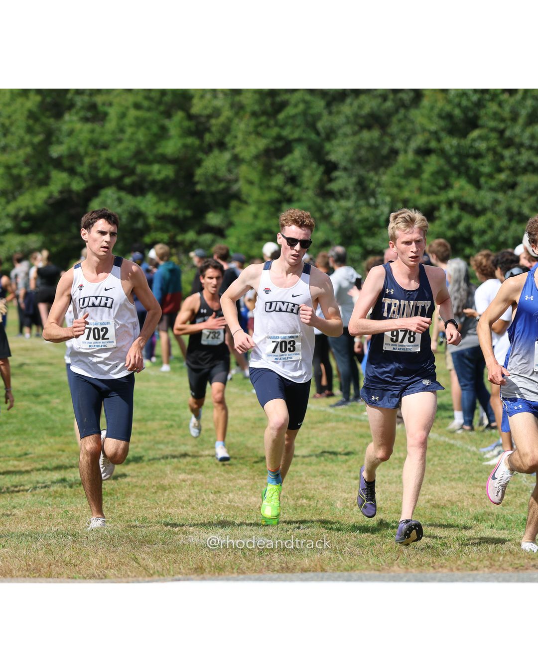 #978 Lysander Duffield, Trinity (Conn.), 8k Run - Men (Gold-35:cap), P26, 25:24.34; #703 Porter Hurteau, New Hampshire, 8k Run - Men (Gold-35:cap), P62, 26:07.82; #702 Carson Fitzgerald, New Hampshire, 8k Run - Men (Gold-35:cap), P55, 25:59.42 - 2026 UMass Dartmouth XC Invitational - UMass Dartmouth - Dartmouth, Massachusetts - September 19, 2026 File: ./260919-2026-UMass-Dartmouth-XC-Invitational-56-398A4630.jpg #978 Lysander Duffield, Trinity (Conn.), 8k Run - Men (Gold-35:cap), P26, 25:24.34; #703 Porter Hurteau, New Hampshire, 8k Run - Men (Gold-…