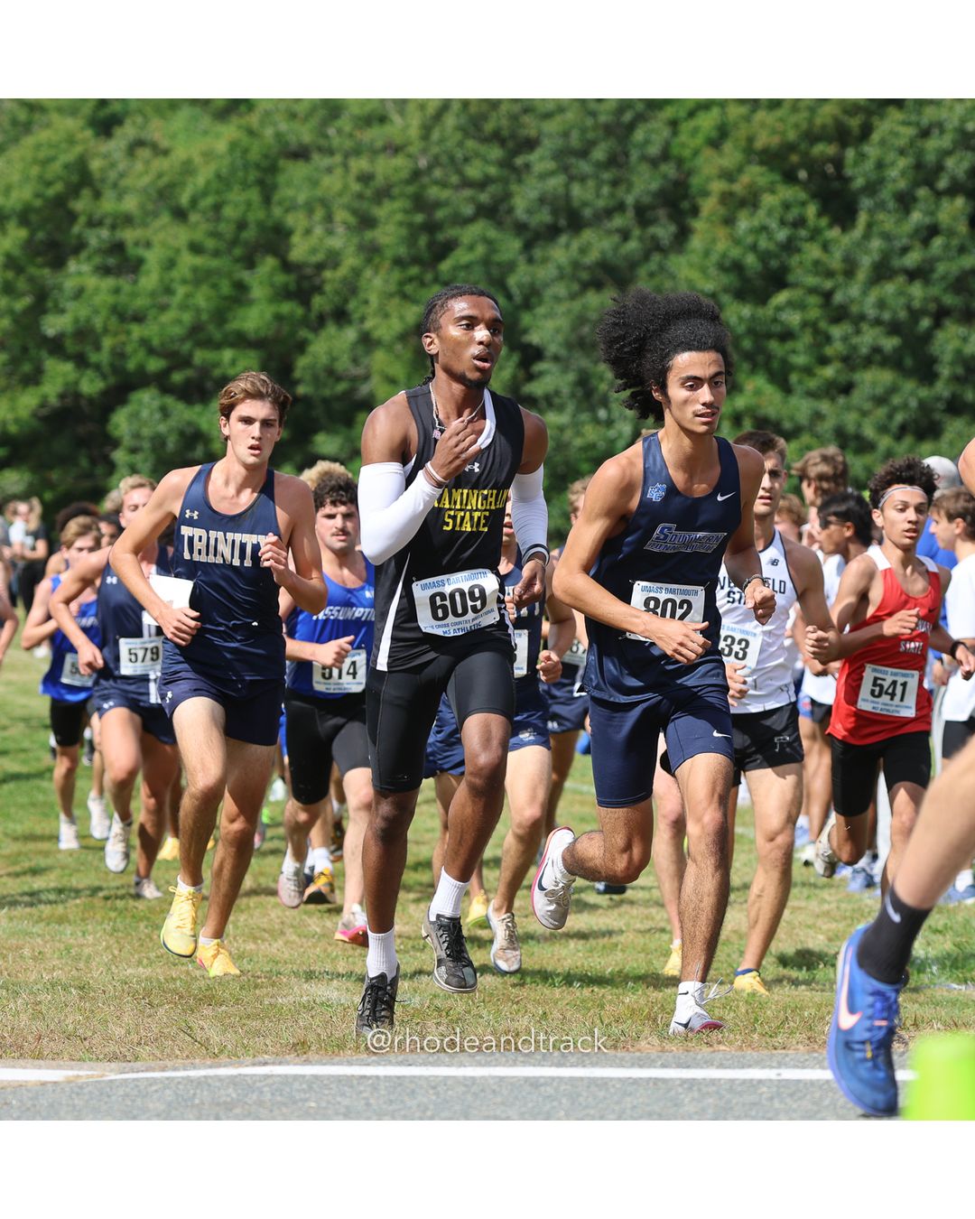 #609 Aaron Corlette, Framingham St., 8k Run - Men (Gold-35:cap), P174, 28:29.35; #541 Tyler Amaral, Bridgewater St., 8k Run - Men (Gold-35:cap), P114, 27:02.09; #33 Jessica Abbott, Boston University, 6k Run - Women (Gold-35:cap), P15, 22:05.87 - 2026 UMass Dartmouth XC Invitational - UMass Dartmouth - Dartmouth, Massachusetts - September 19, 2026 File: ./260919-2026-UMass-Dartmouth-XC-Invitational-92-398A5244.jpg #609 Aaron Corlette, Framingham St., 8k Run - Men (Gold-35:cap), P174, 28:29.35; #541 Tyler Amaral, Bridgewater St., 8k Run - Men (Gold-35:…